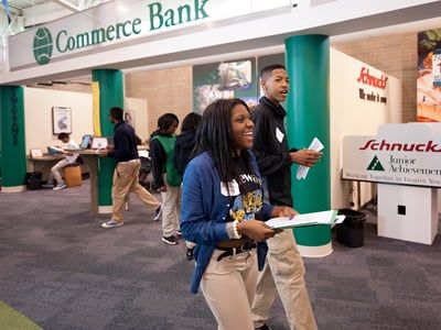 Two students walking through a simulation